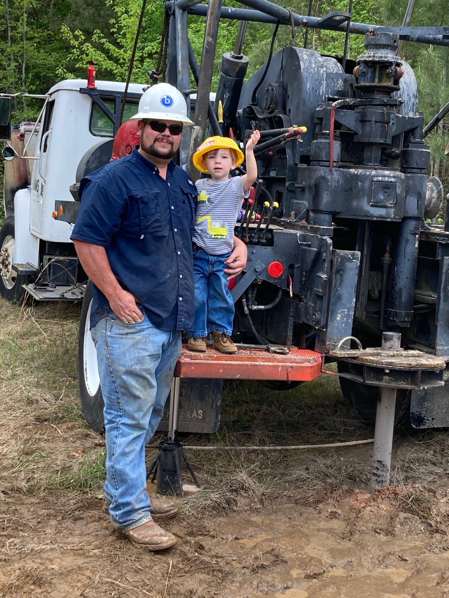 Matt Hughes and his son at a job site